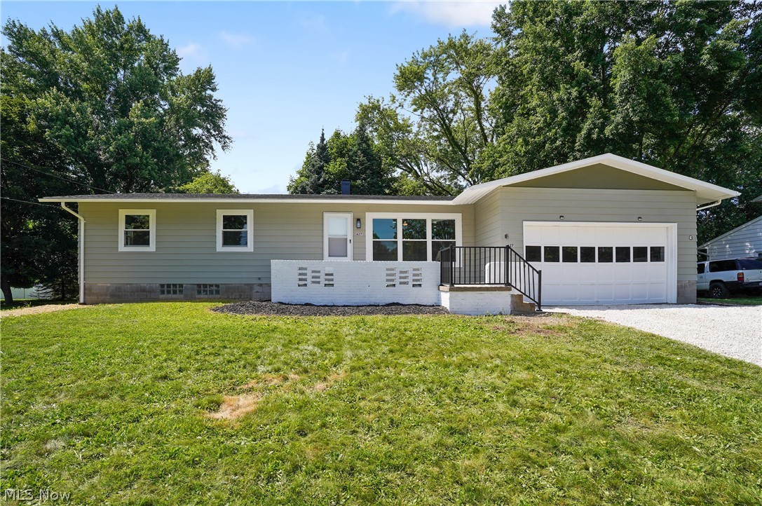 Welcome to this charming ranch-style home nestled in Kent, Ohio, offering a blend of modern updates and cozy comfort. This darling residence features three spacious bedrooms and two beautifully renovated bathrooms. As you step inside, you are greeted by an inviting atmosphere with an open layout that seamlessly connects the living room, dining area, and kitchen. The living room is bathed in natural light, creating a warm and welcoming home. The kitchen is a focal point of the home, boasting white shaker cabinets, granite counter tops, and stainless steel appliance. Each of the three bedrooms offers its own unique charm, featuring large windows that provide plenty of natural light. The many updates throughout include, new roof, windows including sliding back door, back deck and concrete on front deck. Fresh landscaping, new storm doors, new garage door opener, new flooring throughout the house including an added living space in the basement. Updated all lighting, outlets and switches throughout, added new lighting in the bedrooms, living room and kitchen. Updated bathrooms with new vanities and shower hardware. Updated all the door hardware throughout. Whether you're starting a family, downsizing, or seeking a peaceful retreat, this updated ranch home offers a blend of comfort, style, and practicality in a desirable location.