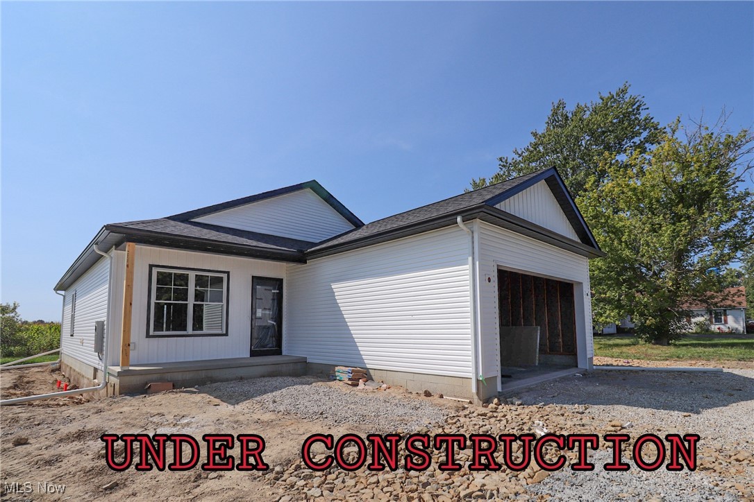 New Construction home currently being built- Photos are from a similar home previously built. This is a 1,382 sq ft Ranch home with two full bathrooms, and three bedrooms to include a Large Master Bedroom and Bathroom with a walk-in closet. The home has a spacious Kitchen and Dining Room with a large Great room. The kitchen countertops are granite, and the bathroom will have cultured marble. A conveniently located laundry on the main floor is located between the Dining room and garage. The two-car garage is drywalled as a bonus. The basement stairwell will be drywalled to make finishing the rest of the basement easy. The basement will have an extra course of block to allow for higher ceilings if the new owner would like it finished. If you purchase prior to completion, you can select the flooring color, paint colors, and light fixtures. This home is located at a dead-end street. Taxes will be adjusted after sale by Wayne County Auditor. Where else can you find a lot with a NEW ranch home in Norwayne School District. Call today for your private showing.