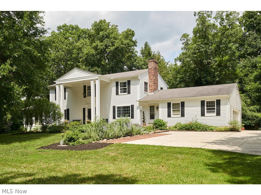 Welcome to this charming colonial in a quiet circular neighborhood in Bath. The main entrance is between 2 story high columns, leading grandly to a large foyer with a double closet. Most of the home has refinished white oak flooring, and the living room has a decorative fireplace, large windows and French doors that lead to the all season sun room. There you will find a newer gas blower fireplace, 7 newer sliders, beams and a nice audio video set up that conveys. The kitchen has hand-made tiger maple cabinets, granite counters with peninsula and Koa wood floors. There’s a slider to the back, a guest bath and a long laundry/mud room that leads to the 2.5 car garage or the front. You will also find a formal dining room and the den with a wood burning fireplace. Upstairs, the primary bedroom has a nice walk in closet and newer tiled shower. The family bath has a new vanity and a tiled tub & shower. There are three other bedrooms, all with wood flooring and double/triple closets. In the ba