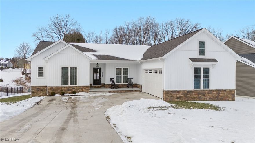 Located in the serene and sought-after area of Columbiana, Ohio, this home, which was built in 2021, beautifully blends modern design with everyday functionality. The hardwood floors add a touch of sophistication, while the heart of the home boasts exquisite granite countertops, stunning cabinetry, and a spacious center island—ideal for both cooking and entertaining. Retreat to the owner's suite, complete with a generous walk-in closet and a luxurious double-sink vanity. A separate area of the home offers two additional bedrooms and a full bath, ensuring privacy for family or guests. The full unfinished basement, with a walk-out sliding door to the backyard, presents endless possibilities for customization. Additionally, the Columbiana County Tax Abatement will be passed on to the new owner, offering significant savings until 2037.