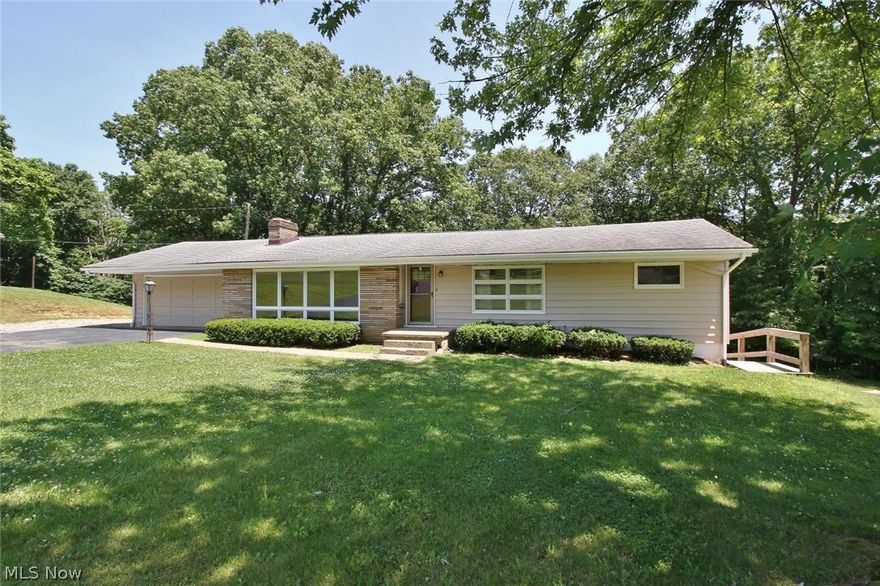 This Ranch home offers 3 bedrooms and 2 full bath , hardwood floors and fireplace , the lower level offers In-law Suite, full kitchen ,4  bedroom with a fireplace and Walk out basement, to the private back yard.