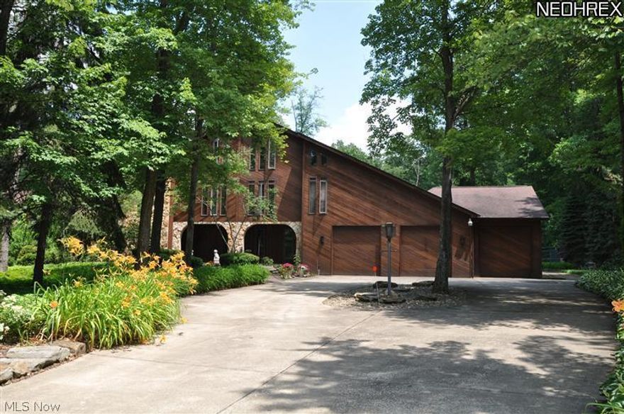 Unique custom home on 1.08 acres features 5 BR, 5.5 BA, large formal living & dining room, fully equipped gourmet kitchen w/walk-in pantry, large island/breakfast bar. Entertain guests in the spacious family room w/fireplace, wet bar, built-in shelving & storage cabinets. The spacious foyer, first floor laundry, office/guest room & fabulous vaulted sun room completes the 1st floor. 2nd floor has 5 bedrooms & 3 full baths. The master suite includes a private office, walk-in closet w/additional walk-in cedar closet, dressing area & sunken jetted tub w/separate shower. Over 1000 sq. ft. 3rd floor has a game room, bath & multi-purpose room w/balcony overlooking the wooded backyard w/tiered decking, pond, Gazebo & tennis court. Five car garage, 2 newer furnaces & separate floor plan-located on a quiet dead-end street!