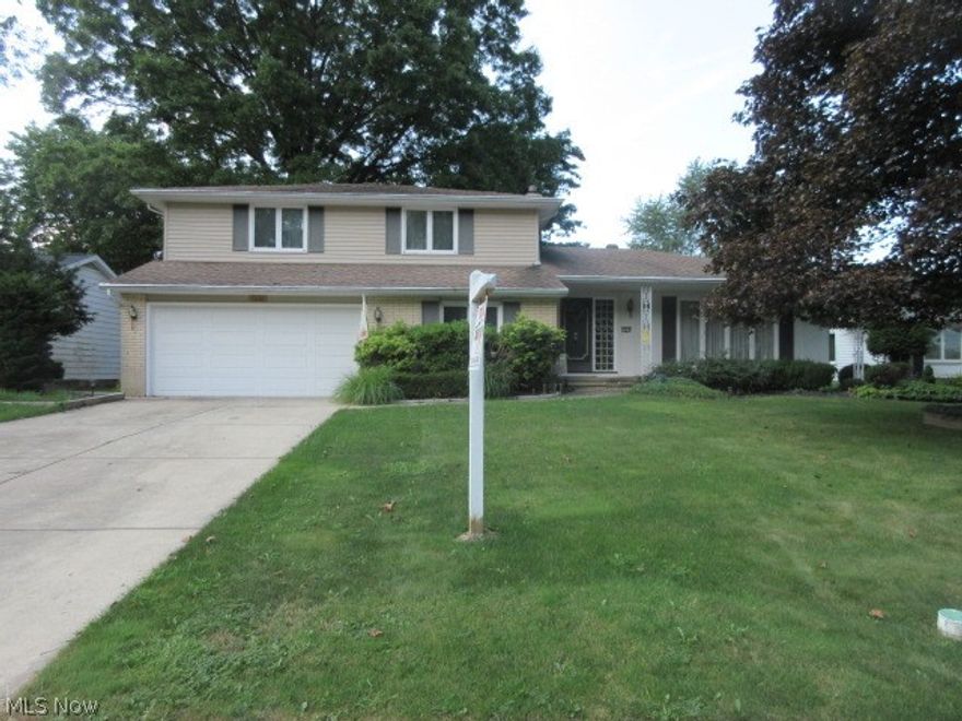 Large split level home. The main level features a foyer, large living, formal dining, eat-in kitchen with built in appliances, family room, office/den and a half bath. The upper level offers 3 large bedrooms, a full guest bath and a full master bath. There is an enclosed sun porch off the 1st floor family room. The basement has a laundry room and a bonus room that is currently used as a music room. New floors in the dining room, kitchen and family. This is all located on lovely Roland Rd., a very desirable neighborhood. Call today for a private showing.