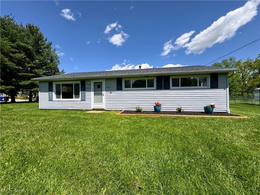 Welcome to your comfortable haven nestled in a friendly, quiet neighborhood in the growing community of Streetsboro.  This inviting ranch-style home, boasting 1,777 sq ft of living space, features three nice sized bedrooms and a bathroom with a convenient walk-in shower.  When you step inside, you experience the warmth of the gorgeous luxury vinyl tile flooring which is both durable and perfect for everyday living.  New carpeting in each bedroom compliments the freshly painted, very clean home.  The added bonus room with adjoining back patio is perfect for cozy movie nights or relaxing with loved ones.  Park with ease in the double car garage which also leaves plenty of room for storage.  The 1/2 acre, corner lot offers space for outdoor activities, gardening, or simply enjoying the fresh air in privacy.  Choose to have meals in the eat-in kitchen or move to the dining room which could easily be used as even more extra space. The benefit of a private well with water softener on the property gives you the extra bonus of no water bill! Updates include new roof in 2018, well inspection in 2024, new gutter helmet in 2022 and central air throughout.  While this home is located in a quiet neighborhood with ample space between homes, it is close to shopping, dining and entertainment as well as the major highways of 480 and the Ohio Turnpike making commuting to Akron or Cleveland a breeze.  Nearby schools, newly added parks and recreational facilities provide opportunities for fun and relaxation for the whole family.  Don't miss out on your chance to make this cozy ranch yours!  Schedule a tour today and discover the comfort and convenience it has to offer.