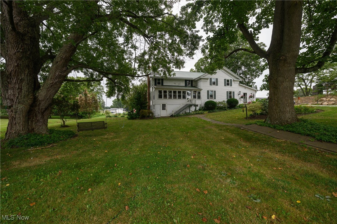 I am pleased to present this amazing home and piece of history, located at 12201 King Church Ave NW, in lovely Uniontown! Nestled on nearly 3 acres just steps away from Lake High School, this charmer offers 5 beds, 2 full baths, and over 2500sqft of cozy living space! What started off as a humble log cabin built in 1850; this home was lovingly transformed into the farm-style home you see today! The first floor offers a massive walk-in pantry just off of the spacious kitchen, a tranquil 4-season room overlooking the property and barns, a wonderful family room/living area offering extreme peace and tranquility, the first guest bedroom which is currently used as an office space, as well as the first floor master just steps away from the first of two full bathrooms! Upstairs offers an extremely unique layout with a couple flex spaces in between the two primary bedrooms and second full bath! Sellers have added newer metal roofs to both barns as well as the main dwelling. The windows, septic system, furnace, and AC are also newer for added peace of mind! Heading outside, you will be greeted by an absolutely stunning lot complete with fruit trees, grape vines, berry bushes, and a massive garden area; talk about homestead ready! Also on the property you will find a massive 2 tiered barn, an additional barn, block workshop with full carpentry setup inside, and a beautiful creek that runs through the center of the property! The truly unique home is sure to turn some heads, call me today to book your private showing and see this stunner for yourself!