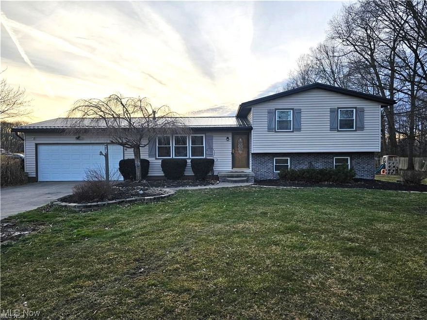 Welcome to this charming split-level home nestled on a sprawling 4+ acre lot, offering the perfect blend of comfort, space, and tranquility. Boasting 4 bedrooms and 2 full baths, this residence provides ample room for both relaxation and entertainment.  Step outside to your outdoor playground, including a hunting blind for the nature lovers and a playground for the kids.

The main level features a spacious living area, ideal for hosting gatherings or simply unwinding after a long day. Adjacent is the dining room with a walk out deck and equipped kitchen with new appliances in 2019.  Other improvements include a new metal roof (2023), A/C Compressor (2023), Wash Machine (2022) & Sump Pump (2023).

Ascend a few steps to the upper level, where you'll find the three bedrooms and a full bathroom, each offering comfortable accommodations and plenty of natural light. 

Downstairs, the lower level presents additional living space, perfect for use as a family room, home office, or gym and a full bathroom – the possibilities are endless. Sliding glass doors lead to the expansive backyard, where endless outdoor adventures await on the vast 4+ acre lot.

Outside, the property showcases plenty of space for gardening, recreation, or even the addition of a pool, allowing you to fully embrace the beauty of nature right at your doorstep.

Conveniently located within close proximity to I-76 for quick commutes, Kent State & Akron Universities. Located in Rootstown School District with the option to open enroll in Southeast Local Schools including Southeast bus transportation.  Don't miss your opportunity to make this stunning split-level retreat your own – schedule your private tour today!