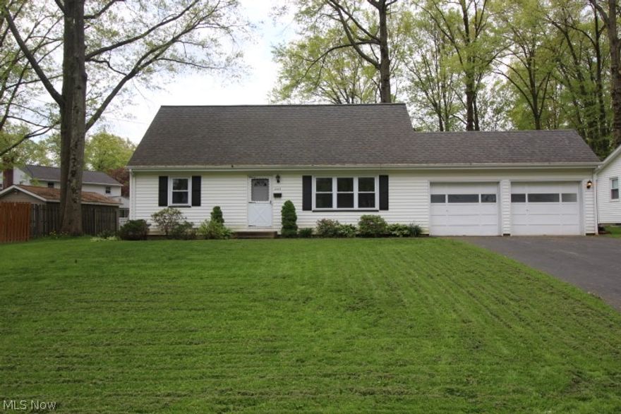 Great curb appeal!  You'll love the gleaming hardwood floors throughout this 4 bedroom, 2 full bath cape cod home. Spacious living room open to the eat-in kitchen with custom built kitchen cabinets, which includes appliances. Two bedrooms and full bath on the first floor.  Vinyl double paned tilt-in windows, maintenance free exterior. Plenty of closet space.  Freshly painted interior.  Full basement.  Attached 2 car garage.  Beautiful back yard!  A must see!