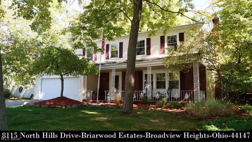 Cherished updated colonial with covered front porch nestled on a heavily wooded park-like lot is much larger than it appears! From the moment you enter, you'll love all the updating that's been done! Glistening re-finished oak floors in formal living/dining rooms - staircase with exposed treads - upper hallway and 2 of 4 spacious bedrooms, a wonderful "L" shaped kitchen with Cherry cabinetry and large Oak floored eating space with bay window , humongous 25x21 great room with wood burning fireplace, 2 1/2 updated baths and basement has finished recreation room! Beautifully landscaped private rear yard offers 50' deck, 15x15 octagon-shaped gazebo with 220 line for future hot tub and 12x12 storage shed with electricity trimmed with delightful gardens that create magnificent views from every angle! Newer gas furnace - hot water tank - range - washer/dryer - family room carpet - rich crown moldings! All appliances, security system, sprinkler system in front yard and a 1 year $390 America's