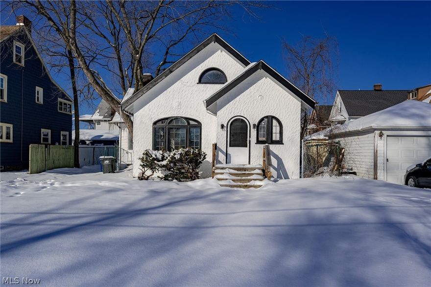 Great opportunity for a charming Tudor style home in Lakewood! This home provides over 1,600 square feet of living space with a mix of classic charm and modern upgrades, including remodeled bathrooms. As you step inside, you will immediately appreciate the lovely hardwood floors that greet you in the living room and flow into the dining room. The living room features a charming fireplace and a large window that frames the front yard. Curved archways lead into the dining room, where you will find a China cabinet with original leaded glass. Off of the dining room, there is a cozy sunroom. The kitchen features an abundance of cabinetry and a sunny eat-in area. There are two bedrooms on the main level, both with hardwood floors and ample closet space. A remodeled full bathroom completes the first floor. Upstairs, there is another bedroom suite with a large bathroom. The lower level provides plenty of room for storage. Outside, there is a large backyard, great for pets! Located on Lakewood