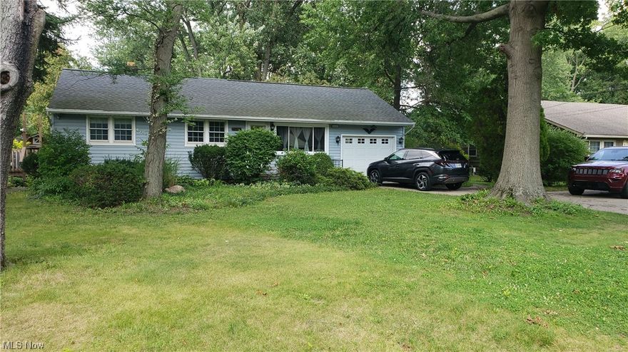 Welcome home to this sprawling 3 bedroom, 2 bathroom ranch sitting on .74 acres! Enjoy hardwood flooring. Cozy up in the huge beamed ceiling family room with brick wood burning fireplace! Updated kitchen and remodeled bathroom. French doors lead to a 4 season room and spacious deck. Finished basement offers a recreation room and office with built-in desk! Super private, large backyard with 2 sheds, garden area and fire pit! One car attached garage with plenty of parking! Roof approximately 5 years old. New H20 heater. Fantastic location! Schedule your showing today!