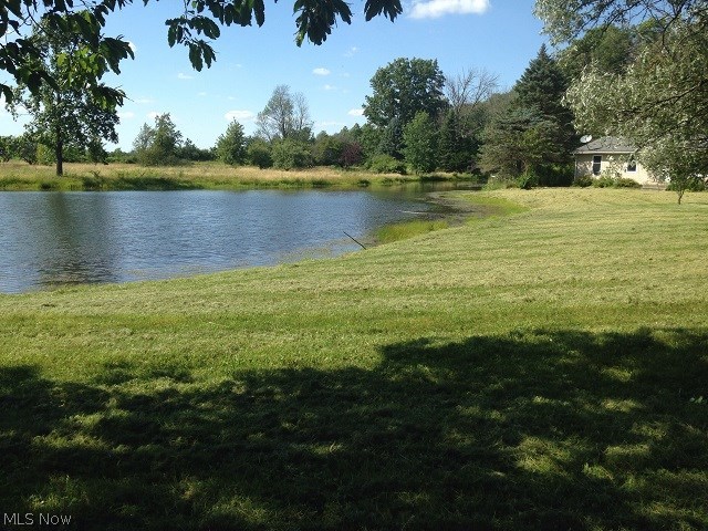 Almost 12 secluded wooded acres with lake & small outbuilding. Nature preserve across the road & Amish farm nearby, 3 bedroom ranch that needs some work. 12x18 deck, 12x14 outbuilding. Home sits back off the road. Property sold " As Is ". See supplement section for PAS requirements & WFHM offer submittal information. Make EMD check out to listing company. Please submit all offders by PDF to listing agent/broker. Contracts & all forms have to have wet signature not electronic signature. HWT and furnace not working.