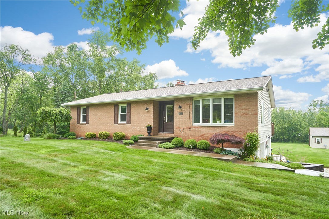 Absolutely spotless raised ranch on 1.5 acres, on a dead end street with a 1500 sq ft outbuilding. Just move in and relax in this wonderful home.The newer glass front door welcomes you into the foyer with tile floor and crown molding. To the right of the foyer is the Living room with a bayed window that view the manicured yard. The kitchen has custom oak cabinets, a large breakfast bar, with granite counter tops, stainless steel appliances, newer subway tile backsplash, and gas fireplace in the hearth area. This is cozy space with a built in desk and sliders to a large deck over looking the very private backyard! Sit, relax and talk to the chef in this spacious area. On the main floor are 3 bedrooms 2 baths. The master ensuite has a newer remodeled bathroom with custom cabinet and tiled shower. All the bedrooms have double closets. In the lower level is a walk out family room with newer LVT flooring, a wood burning stove and sliders to a stamped patio with a fire pit. The fourth bedroom/office is next to the family room ,also with newer LVT flooring and a closet.The attached 2 plus car garage has updated insulated garage doors and opener and painted garage floor.
The outbuilding has 900 st ft perfect for parking cars and toys, then there is an additional 600 sq ft of high ceilings, for additional use , along with a drybar for the make shift "man cave". The concrete drive goes to the home and down to the outbuilding. It tops of the detail and upgrades this home has.