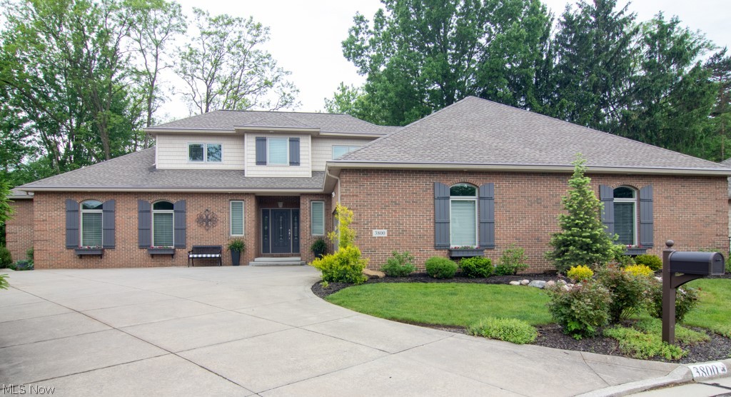 Must see this single family home that offers a 1st floor and an additional ensuite bedroom, a spacious great room with stone fireplace for entertaining, extra large kitchen with dining area, 9 ft ceilings on first floor and extra wide solid wood doors. Two bedrooms and a full bath on the first floor. New roof and gutters - 2020. The beautifully landscaped yard and stone patio surround this tasteful home. Sellers have added approximately $190000 in improvements, additions and aesthetics to make this custom home one to see!