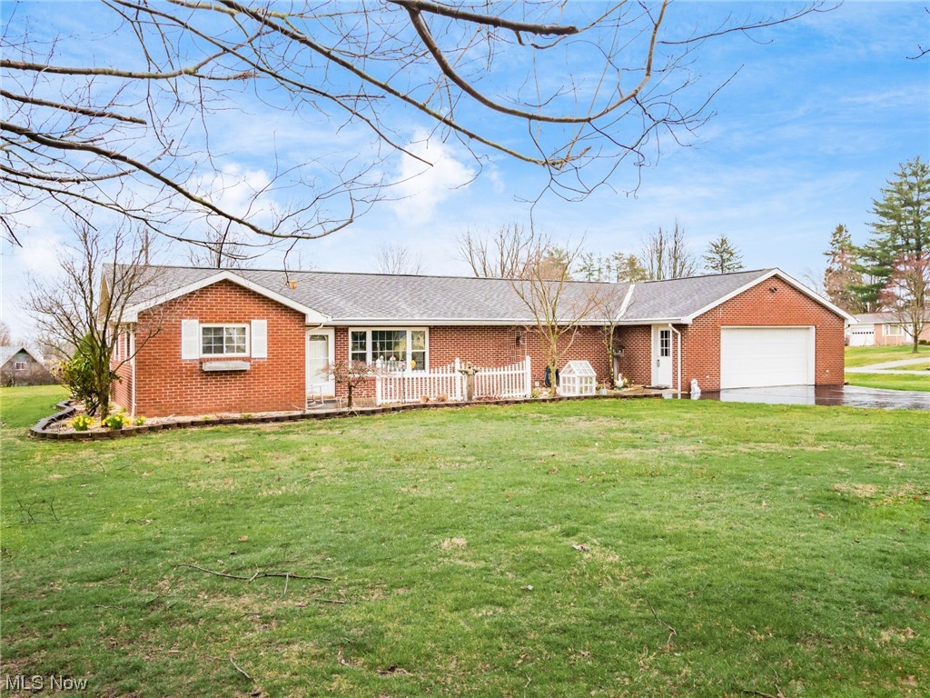 Charming, Brick Home located just minutes from amenities. This 3 bedroom, 2 bath home offers an oversized garage, large storage building, and first floor laundry room and office space. You will enjoy the outdoors as you relax on the lovely, covered back porch. Call and set up your showing today.