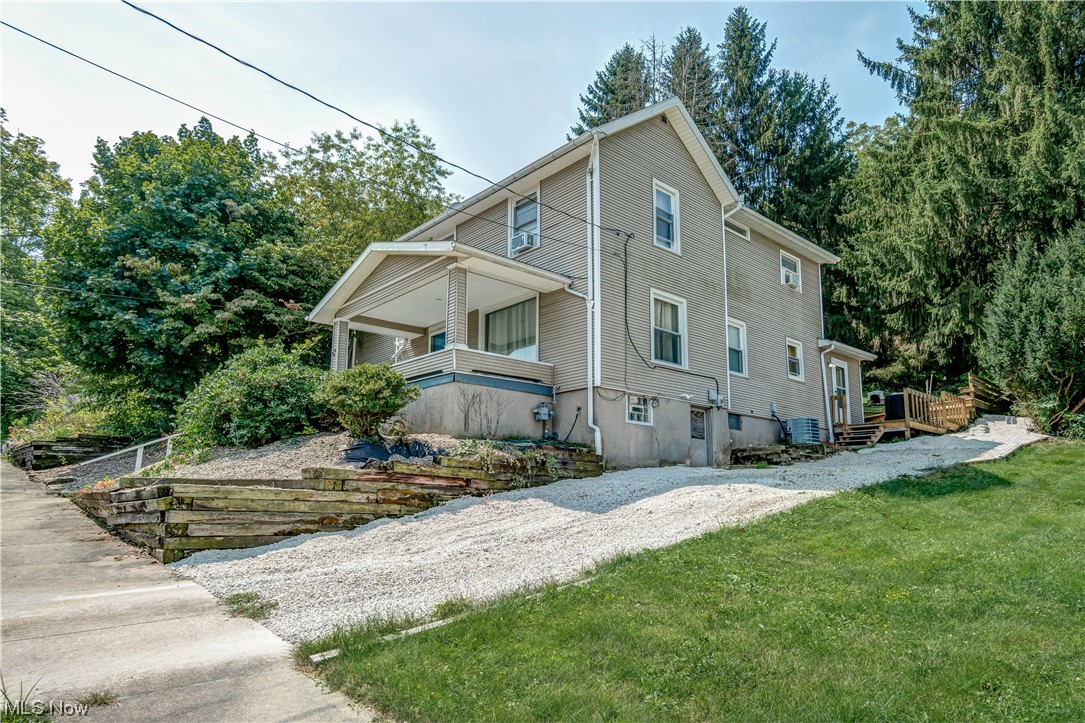 Check out this roomy Colonial-style home located in the Village of Waynesburg, within the coveted Sandy Valley School District. Step inside from the inviting covered front porch to the living room that seamlessly flows into the dining room, creating an inviting space for gatherings. The kitchen offers ample room to unleash your culinary creativity. A full bath with a walk-in shower on the main floor adds convenience and functionality with a brand-new vanity and commode. The ultimate rec room/greenhouse completes the main level. This area comes with a pool table and is ready for you to host friends in this ultimate gathering haven, an oasis of natural light and possibilities! Upstairs, the master suite boasts a spacious layout, three closets for your wardrobe, and a private master bath. Two additional bedrooms complete the upper level. Outside, a multilevel deck beckons, and a wooded backyard for privacy and wildlife watching. You'll find many updates in the walk-out basement includi
