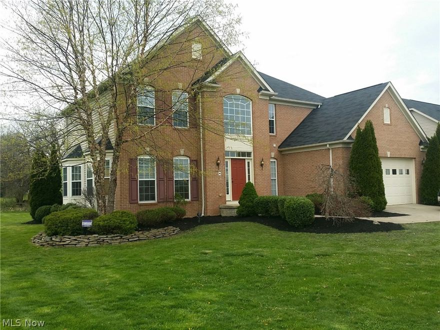 What a Great Find! Spacious colonial offers an open floor plan loaded with extra's. The two-story foyer leads to a waterfall style staircase. Large inviting great room offers walls of windows and a gas fireplace. Expansive kitchen offers new Whirlpool SS appliances, separate island area, bar top and large pantry. On the first floor, you will also find a relaxing living room, trayed ceiling dining room, and functional sunroom; all with an abundant amount of natural sunlight. The second-floor spectacular master bedroom offers a sitting room, glamor bath, and large walk-in closet. This homes other three bedrooms are also located on the second floor and have access to another full bathroom. The lower level is the perfect setting for your next party with a half bathroom, several recreation rooms and a large media room. If you've been looking for a home that is newer and is in move in condition and offers plenty of extras then this is it, contact us today to schedule your own private viewing