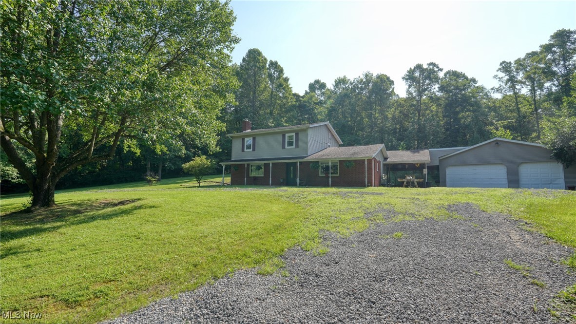 Experience complete privacy on this beautiful wooded 6-acre property within the sought-after East Muskingum School District. This charming two-story home features 3 bedrooms and 1.5 baths, offering a cozy yet spacious layout. Enjoy peaceful mornings or entertain guests on the covered patio, surrounded by nature. The oversized 3-car garage provides ample space for vehicles, storage, or the perfect workshop. Plus, the seller is offering a carpet allowance, giving you the opportunity to personalize the home to your taste. Don't miss this rare opportunity to own a private retreat with endless potential!