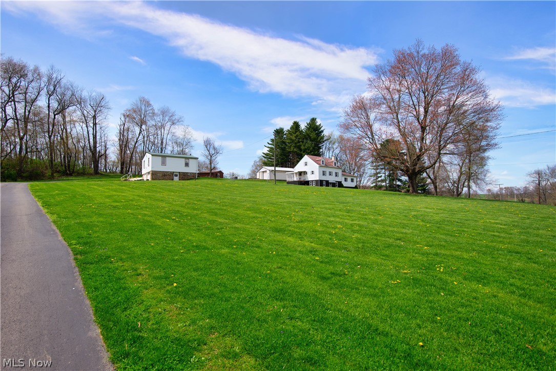 ABSOLUTELY PHENOMENAL OPPORTUNITY! TWO HOMES on over TWO ACRES. 4 Bedroom Main Home - One Bedroom Second Home - HUGE 30 x 40 Pole Building, 2 Car Attached Garage & Barn - on over 2 Acres of Land. Main Home offers a Large Kitchen with eat in Breakfast/Dining Area, 4 Large Bedrooms including one bedroom and full bath on first floor. Lower level has a Huge Rec. Room with walk out basement, Laundry Room and Wood Shop and plenty of storage The huge outbuilding could house 6 cars and has a workshop. The 3 stall barn is perfect for smaller animals or small pony...great for 4H projects. Small Home offers 1 Bedroom, Kitchen, Laundry Room, Full Bath, & Attached Garage. Updates Include: Updated Kitchen with Oak Cabinets, Stunning Hardwood Floors, Newer Roof, & 100 Amp Electric, large driveway was recently paved. Small house currently has tenant with rental income and is renting month to month. Tenant would stay if desired or Would be ideal in law suite etc...Lot's of possibilities. Come ta