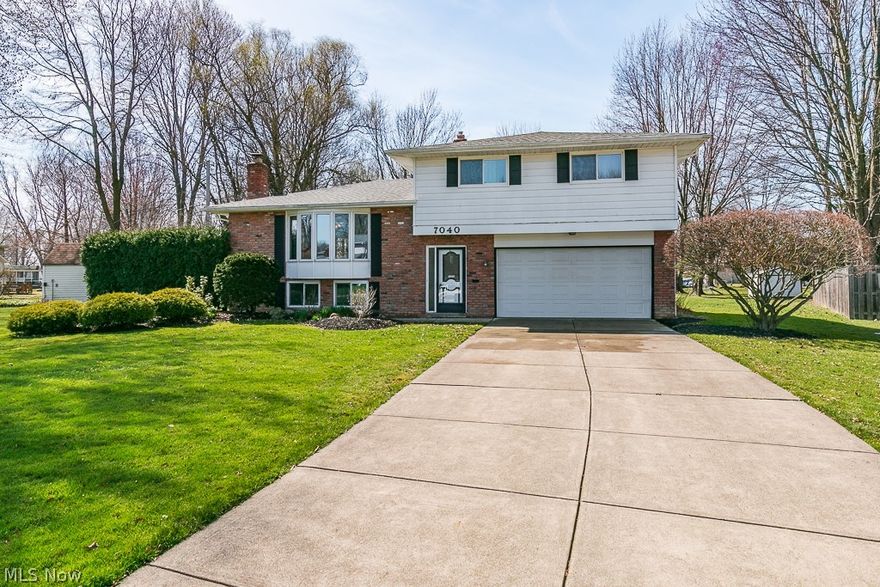 Discover serene living in this inviting 3-bedroom, 1.5-bath split-level home, perfectly positioned on a tranquil cul-de-sac street in the heart of Mentor. Freshly painted and boasting new carpeting throughout the living room, dining room, and stairway, this residence welcomes you into a space where comfort meets style. The eat-in kitchen, a chef's delight, features updated maple cabinets, fashionable countertops, and durable wood plank laminate flooring, with the added convenience of all appliances included.

Designed with entertainment in mind, the adjoining dining room offers seamless access to a large covered deck, perfect for al fresco dining or simply enjoying the outdoors. The dining area transitions effortlessly into the spacious living room, illuminated by a large bay window that floods the space with natural light. Ascend to the upper level to discover three generously sized bedrooms, each adorned with beautiful hardwood floors, alongside the main full bathroom, ensuring a restful retreat for all.

The lower level reveals a cozy family room equipped with a fireplace for those chilly evenings, a large laundry/utility room with new planked flooring and ample storage space, and a workshop area for hobbies and projects. The home also features a 2-car attached garage, ensuring convenience and security.

Step outside to enjoy the beautifully landscaped yard and the privacy offered by the covered deck, making this home a haven for relaxation and entertainment. Additionally, the functional and flowing floor plan is enhanced by the added bonus of a backup generator, providing peace of mind.

This move-in-ready home, with its new carpet and paint, updated kitchen with new built-in appliances, and thoughtful updates throughout, offers an affordable yet well-maintained living option. Your search for a charming and affordable home in Mentor ends here. Experience the perfect blend of tranquility, convenience, and comfort in this delightful residence.