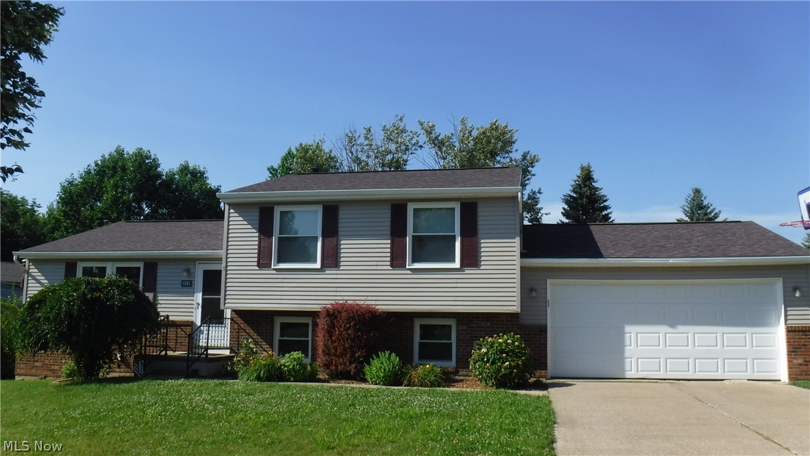 Nicely updated four level split with three good sized bedrooms. Kitchen and dining room combination is open to the large living room. Kitchen with white cabinets has newer stainless dishwasher and refrigerator which stay. Dining room has french doors that open to the deck overlooking the private backyard. Newer 2015 playset with slide and swings also stays along with the invisible fence for your pets. There are two updated baths done in 2019, one full on the second floor and a half bath on the lower level along with the family room, laundry room and a mud room which leads to the 2 car garage. The finished rec room in the basement can make a great play room or office. Another room has built in shelves for lots of storage. New roof with tearoff - 4/2019. Aluminum siding painted 6/ 2019. New family room carpet - 4/2019. Windows replaced in 2013. Garage door and opener replaced within last 10 years. Shopping minutes away. Don't miss out on this one.