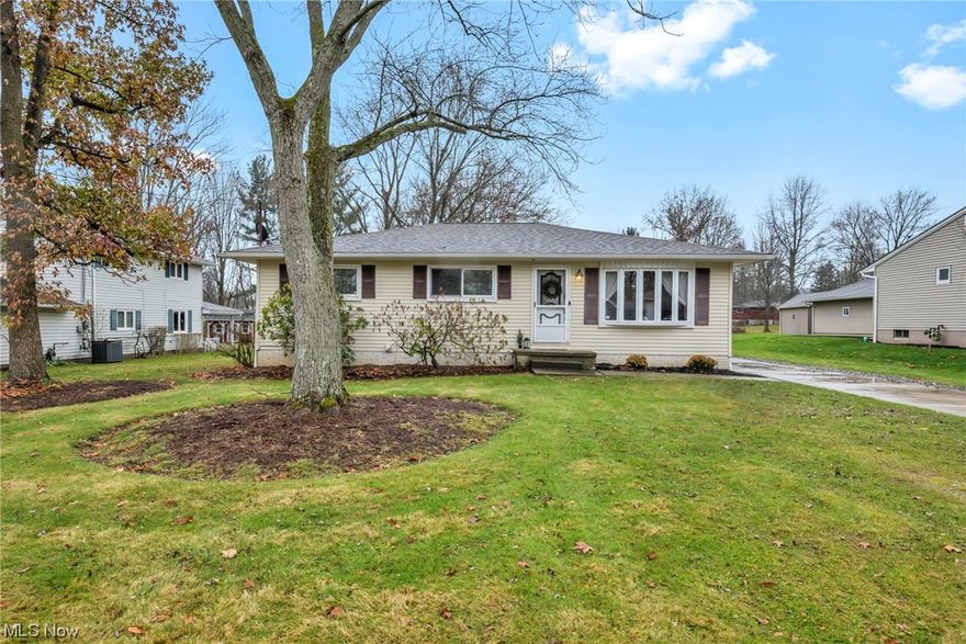 Rare find! This ranch-style gem is nestled in the sought-after Birchwood Hills development of Twinsburg with Birchwood park right down the street. Impeccably maintained and completely updated, this residence is ready for you to move in and start creating memories. Situated on an expansive half-acre lot, the largest in the neighborhood, this home offers both space and comfort. The oversized 2-car garage and central air add to the convenience of modern living. Step inside to discover a thoughtfully designed floor plan, highlighted by new hardwood flooring throughout the first floor. The spacious master bedroom features dual closets and a convenient half bath, while two additional bedrooms and a stylish full bath complete the main level. The remodeled kitchen is a chef's dream, boasting custom-built cabinets, quartz countertops, and a sleek hood that overlooks the generous island. Equipped with stainless steel appliances, including a refrigerator, dishwasher, and built-in oven, the kitchen opens to a charming back patio. The sizable basement is a versatile space, featuring a 41 x 18 rec room with ample closets and an updated full bathroom. The laundry room is bright and clean, and storage space abounds. Noteworthy updates include a fully waterproofed foundation in 2020 (complete with a lifetime warranty from Ohio State Waterproofing), a new electrical panel box in 2020, a freshly carpeted basement in 2023, and Nest safety and security technology throughout the home. Other enhancements include hickory hardwood flooring (2018), a finished basement (2021), and luxury vinyl plank flooring (2018).