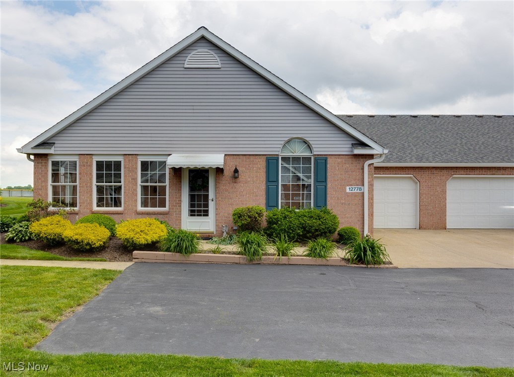 Location, location, location!! Welcome to Hartville, named one of Ohio's Best Hometowns, where you will enjoy beautiful scenery, rich history, and small-town charm. This lovely 2 bedroom, 1.5 bath condo is less than one mile from the Hartville Hardware (America's largest independent hardware store), the Hartville Kitchen, the Hartville MarketPlace and Flea Market and dozens of small shops and restaurants! Step into the welcoming sunroom at the front of the home, flooded with natural light, creating the perfect spot to sip your morning coffee or gather with friends and family. Inside, you'll love the open concept living and dining area, where a vaulted ceiling adds a sense of space and style. The kitchen features natural oak cabinetry, two pantries, and some newer appliances. Conveniently located off the kitchen is a combination laundry room/half bath with ample storage. The primary bedroom is quite roomy with a large walk-in closet and private entrance to the main bath which is 11' x 9' and includes a tub, a separate, walk-in shower, plus lots of storage! The 2nd bedroom can be used for guests, an office or whatever you need. There is also a partial, unfinished basement (off the garage) with a workbench, a water softener and extra storage. As a sought-after end unit, this condo offers extra privacy, peaceful surroundings, and lush, well-maintained landscaping. A home warranty is included, making this gem even more appealing. Don't miss out, call your favorite Realtor and schedule an appointment today!