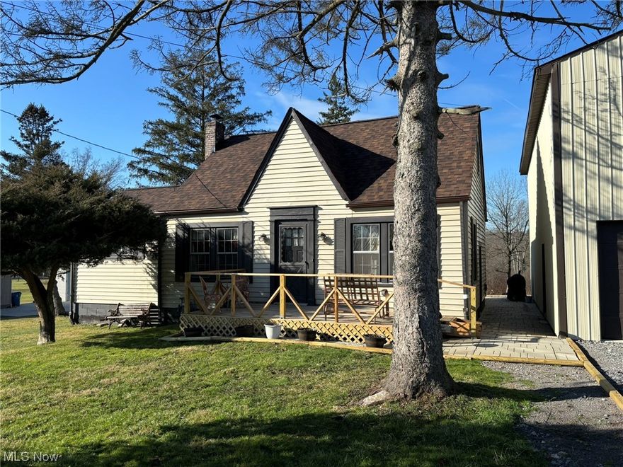You don't want to miss this quaint three bedroom cape cod on 16 acres!  Two bedrooms are located downstairs and the third is upstairs.  Updates include new roof 2022, furnace 2012, and hot water tank 2019.  The large four car garage has a second story for plenty of storage.