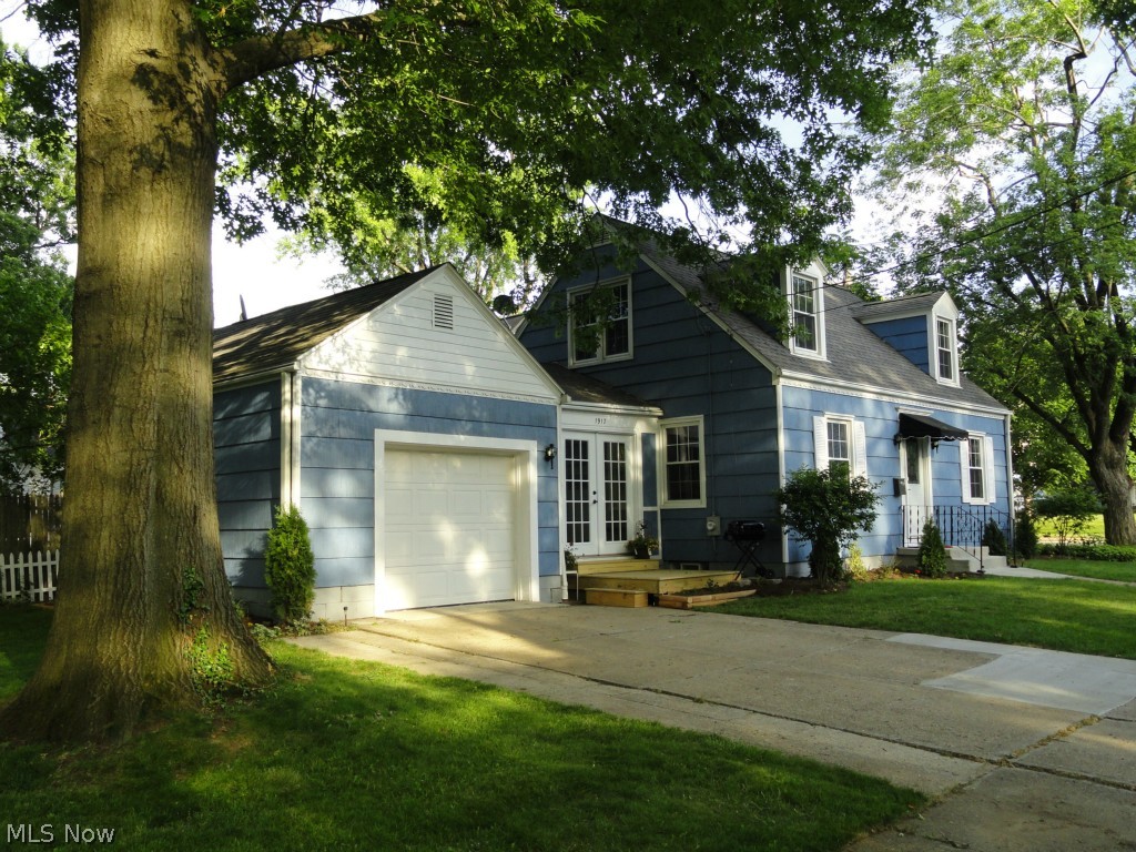 Charming Cape in desirable Falls neighborhood beautifully restored with quality finishes and tasteful décor throughout. The extensive remodeling includes a gorgeous new kitchen with cherry cabinets, new counters, stainless appliances and porcelain tile floor. Dining room and spacious living room are neutral, light and bright. Beautifully refinished hardwood floors throughout. 2 full baths (one on second floor off master bedroom) both completely remodeled with stylish fixtures and porcelain tile. Professionally finished rec room with new carpet, utility cabinets, and built in speakers for a media center. New deck, entry slab, doors, light fixtures, garage door, water tank, electric, washer, and exterior paint. Updated roof, gutters and windows. Must see!