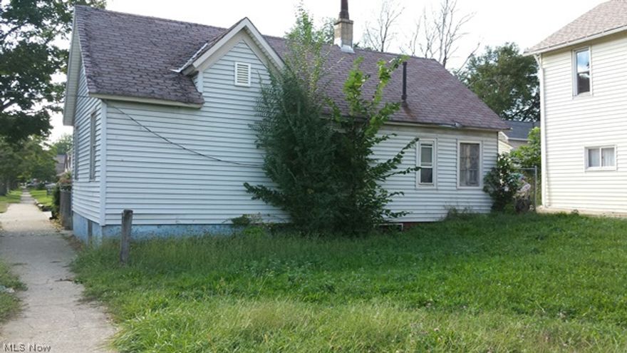 Detroit Shoreway Cottage! Home has been gutted. Needs a rehabber to bring back to life. Home has good bones.