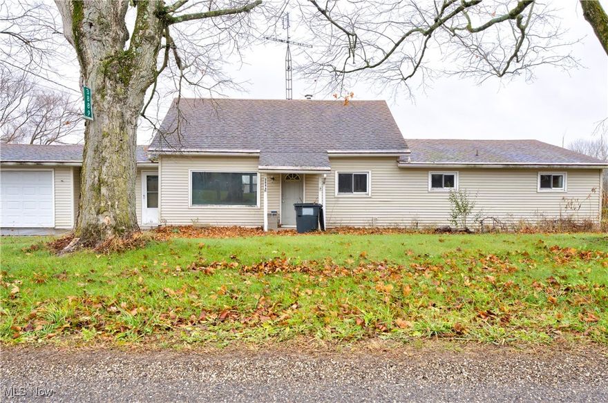 This Mineral City ranch-style on a one-acre lot is stripped down to the studs and ready for transformation. The main floor includes a living room, a large open space intended for a kitchen, a laundry area, three spacious bedrooms, and a full bath space. A large sunroom at the back overlooks the expansive lot, providing potential for an all-season living area. The upstairs is framed to be finished as an additional bedroom, offering extra space and flexibility. The walk-out basement includes a large recreational room area, ideal for additional living or storage. An attached one-car garage with a driveway drain is connected by a breezeway to a two-car oversized detached garage, providing substantial storage or workspace. With the structure in place and ready for finishing, this is an ideal investment opportunity in Mineral City.