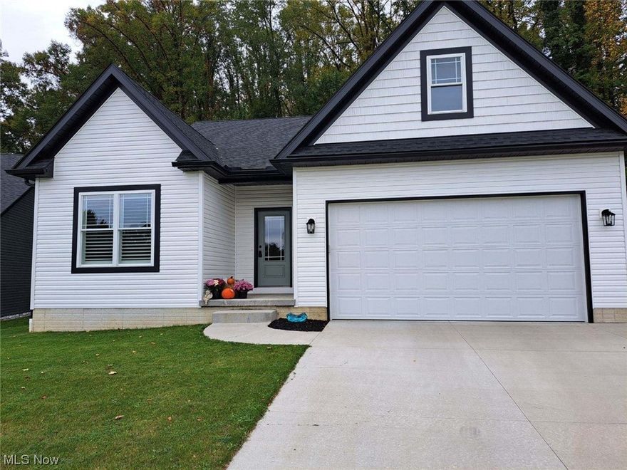 Experience the allure of small town living with this nearly new ranch home. Nestled on a serene wooded lot, this property exudes charm and modern elegance. Enjoy the  open floor plan with a vaulted ceiling in the living room and kitchen, perfect for gatherings. With stainless steel appliances, LTV flooring, and 2 full baths, its completely move in ready. Immaculate!  Dont miss this great opportunity!