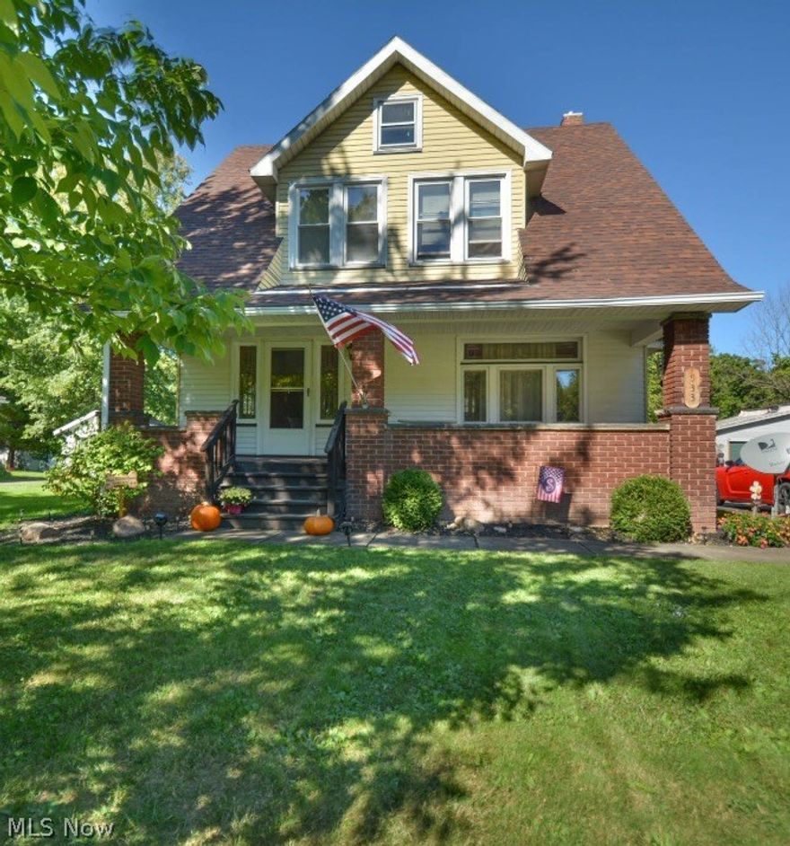 Old house people.. This one is for you! Mineral Ridge  cape cod on nearly an acre! This turn key home has so much to offer. The spacious front porch leads into a huge living room with leaded windows, amazing natural woodwork, French pocket doors and grand staircase. The formal dining room with window seat and built in china cabinet is large enough to entertain the whole family. Updated kitchen with newer floor, cabinets and neutral countertops leads out to the back porch that overlooks the huge yard. Upstairs is large bath with claw foot tub and pedestal  sink that keeps the old fashioned feel. 3 nice sized bedrooms and a walk up attic offering tons of storage. Original hardwood floors under all carpet. The basemant has  glass block windows and even more space for storage. 2 car heated garage, extra parking and Meander Fish and Game Refuge at the back of yard. Extremely well maintained, must see this one in person.