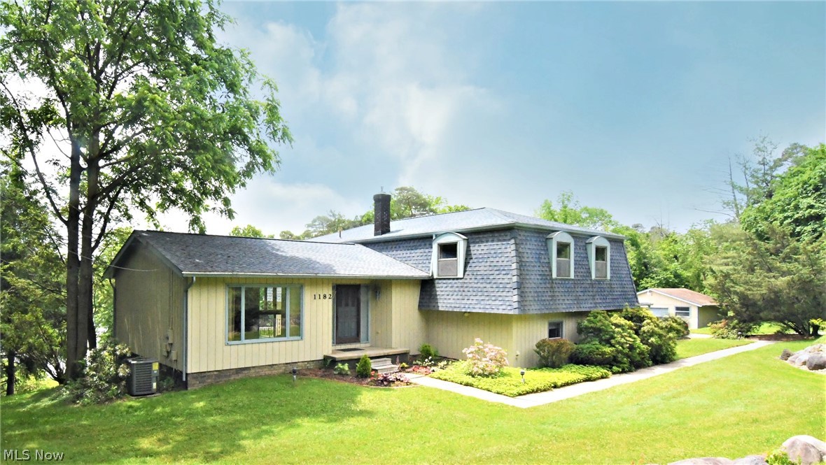 Walk in and say "Wow" to the view that greets you as you enter this lakefront split/contemporary style property offering total privacy! The large windows offer so much natural light - its's a beautiful setting. There are 2 decks overlooking the lake so imagine enjoying your morning java with peace and tranquility of the water and trees (the decks are off the dining and family rooms). The gorgeous inground pool, pergola & lounging area are perfect for relaxing & entertaining...again with views of the lake. The kitchen features an entire wall of built ins - perfect for a pantry & features stainless steel appliances. There is a cut out between the kitchen & fireplaced family room. A large office is perfect to work from home or could be a bonus rm. This home is technically a 4 bdrm; however, the current owner removed the door to one of the bdrm's to make it an office off the master bedroom. This room could easily be configured back into a 4th bdrm. Updates include: Hardwood flooring in Living room and entrance hallway (12/18); Roof and gutter covers (6/16); high-efficiency furnace/AC (8/10 - includes extended warranty through 8/20); master bath sink/counter (2/19); & bath vanity/granite (4/17). See attached list for additional updates. Handy walk-in shower in laundry room for use after using pool. Home warranty is offered for peace of mind. Three car garage (2 car attached plus detached 1 car garage, which also houses the pool equipment). Easy access to Cleveland.