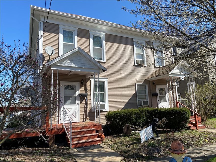 Great investment property.  Side by side duplex.  Each unit has living room, kitchen, dining room, full bath, half bath and laundry.  Unit 1 is furnished with range, refrigerator, washer and dryer.  Large deck off back, chain link fence and storage shed.