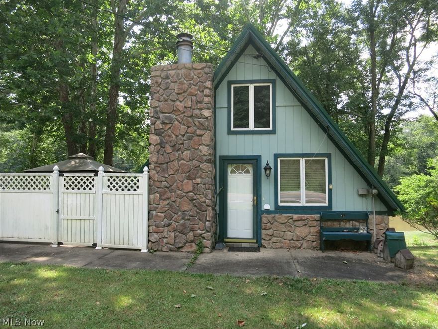 Charming 1 bedroom wood siding and stone A frame on the Little Kanawha River. Property features a detached garage, seperate laundry building and super large deck overlooking the river. Argubably one of the best river access locations for fishing on the Little Kanawha. Perfect weekend get away to relax or entertain friends and family. Cash only, as is, ground has settled causing cracks and foundation issues. Come look and make an offer.