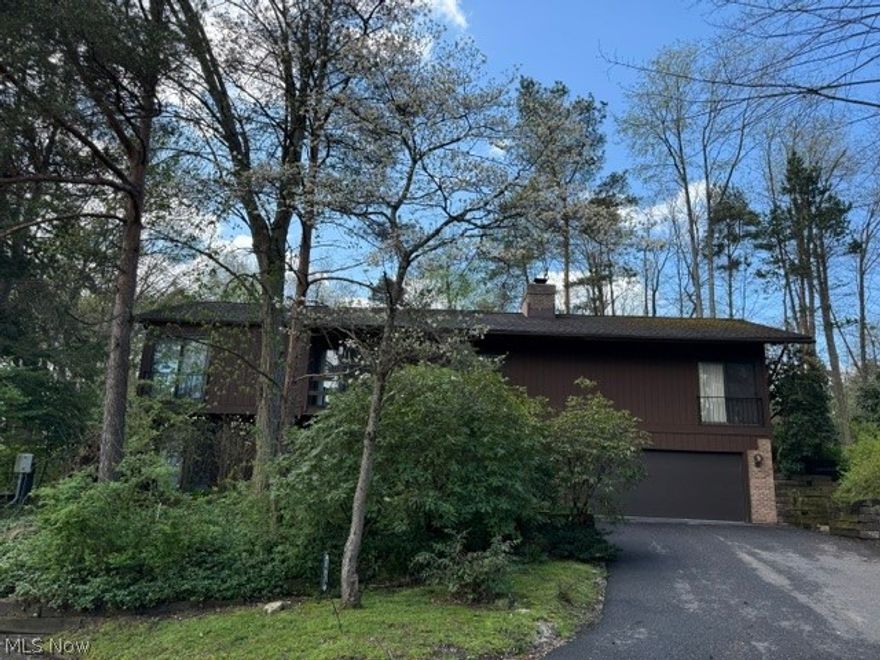 Spring has arrived at 1938 Hemlock Dr, the Azaleas, Dogwood and Lenten-rose are awaiting to greet you.  Welcome to 1938 Hemlock Dr Kent Ohio. This stunning 3 bedroom 2 full and 1 half bath condo has so much to offer. It is located in a quiet secluded comfortable nature setting. This condo has vaulted ceilings, beams, and an open floor plan. Entering the home, you will see a beautiful 2 story foyer with a see-through brick fireplace. The first floor has 2 bedrooms, a laundry room, bath and garage access. This first floor could be used as an additional living suite. Entering the second floor you have vaulted ceilings, a master suite with a walk-in closet and bath. The formal dining room has spacious views and access to a remodeled galley kitchen with an eating area. The great room is a GREAT room, large with natural light and a fireplace. This condo is a must see! Call today!