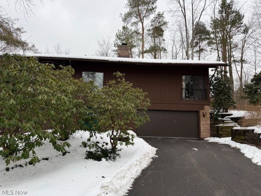 Welcome to 1938 Hemlock Dr Kent Ohio. This stunning 3 bedroom 2 full and 1 half bath condo has so much to offer. It is located in a quiet secluded comfortable nature setting. This condo has vaulted ceilings, beams, and an open floor plan. Entering the home, you will see a beautiful 2 story foyer with a see-through brick fireplace. The first floor has 2 bedrooms, a laundry room, bath and garage access. This first floor could be used as an additional living suite. Entering the second floor you have vaulted ceilings, a master suite with a walk-in closet and bath. The formal dining room has spacious views and access to a remodeled galley kitchen with an eating area. The great room is a GREAT room, large with natural light and a fireplace. This condo is a must see! Call today!