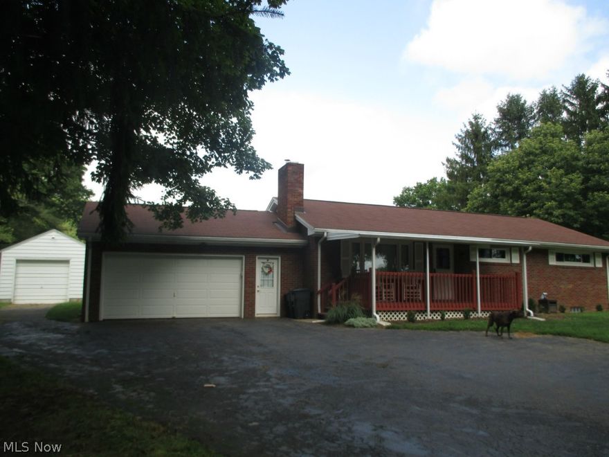 Well maintained brick ranch on 2+/- acres.  3 bedrooms, 1.5 baths.  Freshly painted walls.  Hardwood floors.  Stone fireplace with Pellet stove in the living room.  Updated oak kitchen with breakfast bar and ceramic tile floors.  The kitchen opens to the dining area.  Full basement with b-dry water proofing system with new sump pump in 2012.  Glass block windows installed in 2012.  Covered rear patio.  2 car attached garage & 1.5 car detached garage.  In ground invisible pet fence.  Rewired in 2013.  Vinyl thermo replacement windows and doors throughout.  City water and sewer to the home.  Well water for 4 outside spigots only.  Pressure tank replaced in 2011.