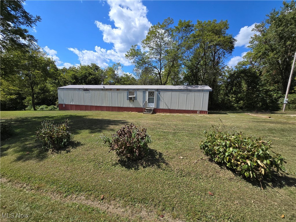 Imagine What You Could Do With This Property! 1989 14x66 Singlewide on 1.44 ac that has public water, septic, 1 drilled water well, 1 dug water well, mature trees and aprox 485 +/- ft of road frontage.