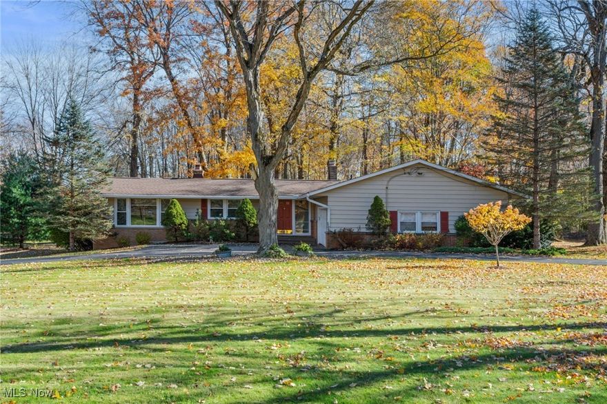 Experience lake living at its finest in this spacious ranch home in the private lake community of Sherwood Park. Set on over 1.2 serene wooded acres, this 4 bedroom, 2 full bath home offers over 3,300 sq ft of living space including the lower level. The inviting living room features a floor-to-ceiling stone faced, wood burning fireplace that serves as the focal point separating the living & dining spaces & the expansive picture windows frame sweeping views of the lake & surrounding landscape. The spacious family room featuring vaulted ceilings accented with exposed wood beams & the step-down layout creates a natural flow from the living room making this space ideal for gatherings or entertaining. The eat-in kitchen offers a breakfast bar, granite countertops & ample cabinetry space and opens to the dining room. The primary suite with ensuite bath & 3 other bedrooms & a full bath complete the main level. The expansive lower level rec room features a floor-to-ceiling brick WB fireplace & a bar area, perfect for hosting gatherings or game nights with plenty of room for multiple activity zones. An additional large room in the lower level can be used as a work out area, play room or just for extra storage. So many options! Circular driveway leads to the 2 car attached garage. Gorgeous fenced in yard! Recent updates include: Replaced roof (2020), replaced furnace (2018), replaced central air (2020), full bath remodel (2020), replaced dryer (2023), replaced dishwasher, stove, refrigerator & microwave (2012), kitchen remodel (2010). INCLUDED: All kitchen appliances, washer, dryer, window treatments & fire pit in backyard. Conveniently located near I-271, US-422, OH-91, restaurants, shopping & other local attractions. Sherwood Park offers a little slice of heaven with lush greenspace, stocked lake, gazebo, benches & a picnic area. This home is a must see...