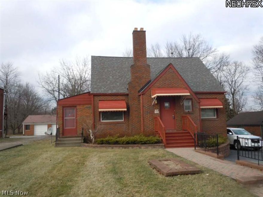 All brick 2 bedroom 1.5 bath Cape Cod zoned residential on commercial strip.  Large living room, dining room, office/den, hardwood floors, newer furnace.  2.5 car garage, roof approximately 4.5 years old.