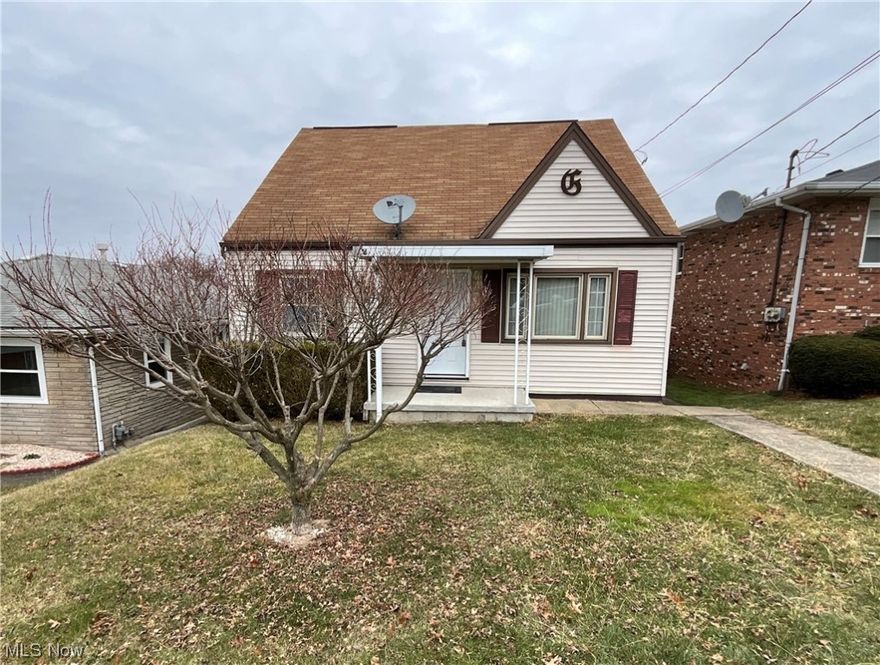 Discover the perfect blend of comfort and style in this charming 3 bedroom Cape Cod. Step inside to find a freshly painted interior in neutral tones complemented by luxurious vinyl flooring, creating a warm and inviting ambiance throughout. The fully equipped kitchen, adorned with stainless appliances, is a culinary haven that opens to a delightful deck, perfect for alfresco dining or morning coffee. The extra large primary bedroom is a true retreat, boasting double closets and a private half bath for added convenience. With numerous updates throughout, this residence offers modern convenience while maintaining its classic charm. Take advantage of the Weirton Heights location, providing easy access to local amenities and a welcoming community atmosphere. Call to see this home today!
