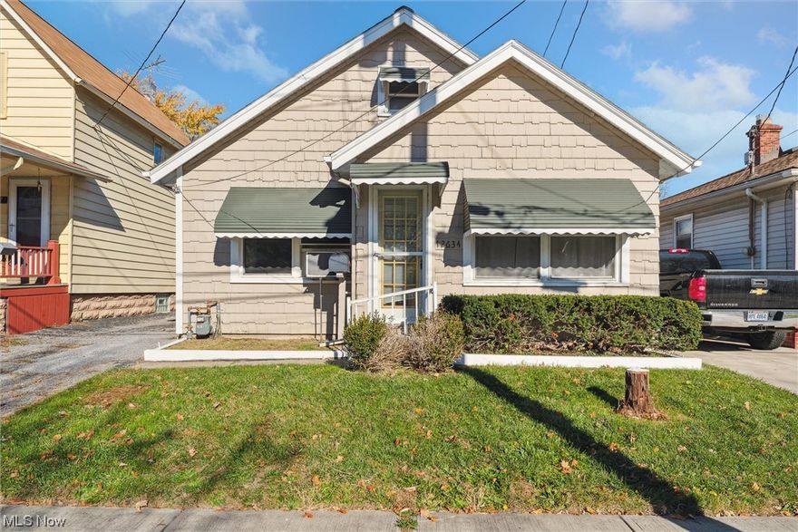 There are so many things to love about 12634 McGowan Avenue! 3 bedroom bungalow with 2 bedrooms on the first floor and a huge third bedroom on the second floor. This home features a large living with newer vinyl windows through out, an updated bathroom, new vinyl flooring, first floor laundry, and a bonus room that can be used as an office, game room, storage- or whatever fits your needs! The enclosed back porch leads out to your fully fenced yard and large 2.5 car garage. The current owners completely rebuilt and expanded the garage and painted the interior and exterior of the home! Whether you are looking for your starter home, downsizing to easy one-floor living, or looking to invest in Cleveland Real Estate, this house is sure to fit your needs! Schedule your showing today!