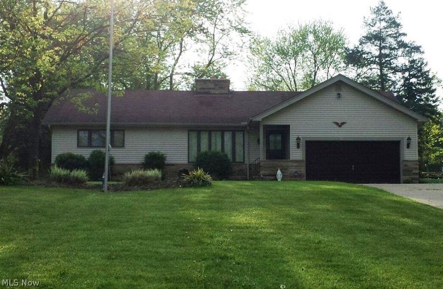 Pride exudes in this One Owner home! Situated on an acre lot, this 3 Bedroom / 2.5 Bath Ranch has a full Basement and full Attic. One of the rooms in the Attic is roughed in for a bedroom, complete with built-in desk and walk-in closet. Large Basement features Laundry area, a Pantry, a half Bath, Huge Workshop area and a very large Rec Room with a bar that is roughed in for wet bar. Hardwood flooring lies beneath the wall-to-wall carpet on the main floor. Possible In-Law Suite/Family Room with separate entrance. The backyard boasts a 33'x 22' brick Patio for summertime fun and in the cold months entertain family and friends in the 13' x 35' Rec Room! Seller providing a one year Home Warranty.