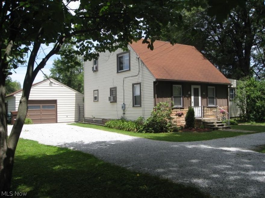 Location, Location, Location! Neutrally updated home located directly on Portage Lakes, Long Lake. Convenient location right next to state boat launch. Stunning views from back of home and seasonal views from the sides. Good bedroom sizes.  Updates include new ceiling fans except first floor bedroom 2014. Roof on top level flat roof done 2013.  New Carpet throughout home, garage exterior repaint, interior house repaint in neutral colors, and stylish commercial grade vinyl floors in kitchen, first floor bath and seasons room all 2012.  Flat Roof over first floor bedroom and seasons room 2011.  Hot water tank done in 2008. Bryant High efficiency furnace done in 2007. This home boasts updated Kitchen, mostly vinyl siding on house and double hung windows. First floor laundry. One car garage with plenty of extra storage. Gorgeous Lake Views from Master Bedroom Balcony straight from bed. Large, mostly fenced in back yard. Seasons room to enjoy the lake views year round.