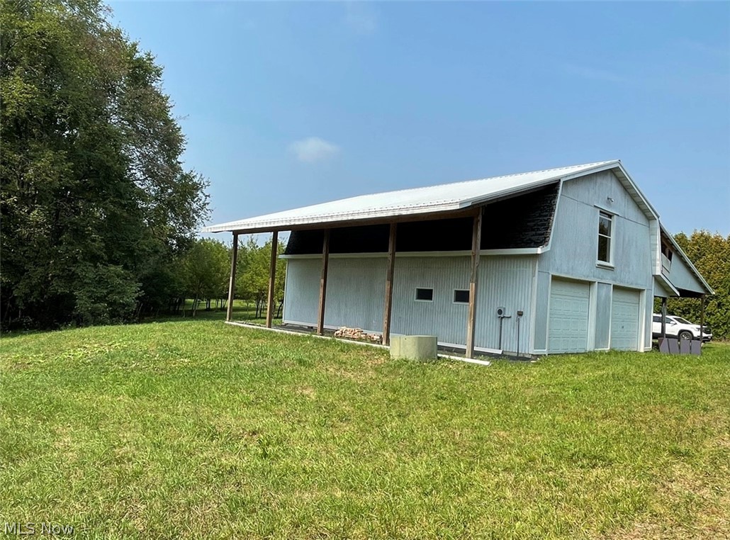 Great Building sight in Minerva OH!!! 4.279 acres with Electric already on the property!! Property goes to the left where you will find a 2 story 40x30 garage. It has 8 inch concrete floors and 12” rafters. Each side of the garage has a nice sized lean-two. Per the deed restrictions no mobile or manufactured homes are permitted.