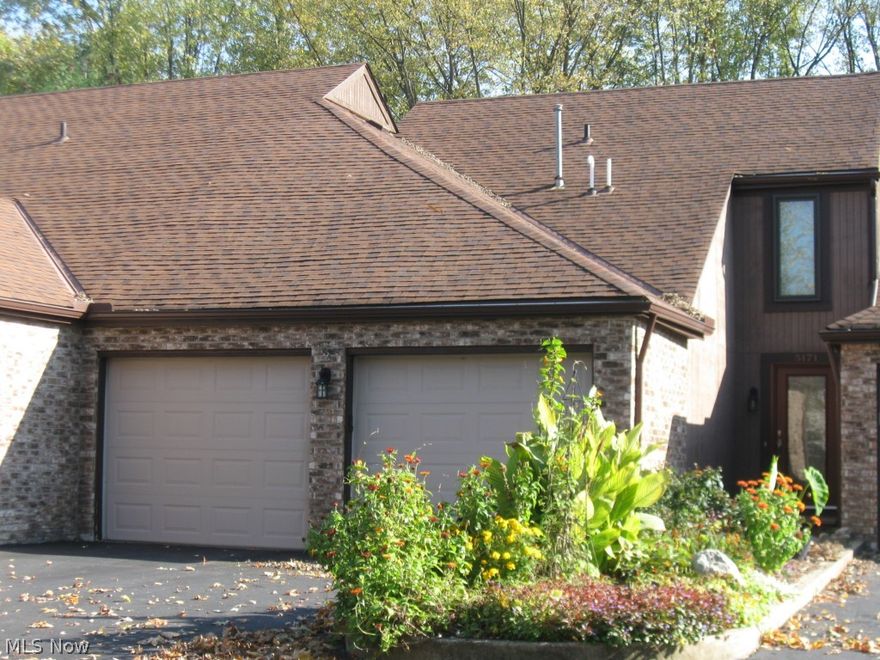 Welcome to convenient condo living with easy access to all that Rt. 18 & Medina have to offer yet tucked away in a quiet, wooded neighborhood. 2 BR, 2 1/2 bath brick/cedar, 2-story condo offers 1456 sf, a remodeled/eat in kitchen, ALL appliances (includes new, large capacity W&D), 2 car att. garage & FP. 13 1/2' x 11' kitchen (no galley) is a rare find in a condo & features a generous amt of storage/cooking space, quality stainless steel appls, pantry cupboard w/ roll-out drawers, newer flr, & breakfast bar. Comfortably-sized great rm can accommodate a large screen TV, addt'l dining space for entertaining + a beautiful FP for those chilly evenings. MBR features a great view, walk in closet, addt'l wardrobe closet & private FB with sit down dressing table. Hall bath offers titled shower & extra deep tub. All baths have new commodes & quality faucets. Nearly all newer Pella windows & front door. High-eff furnace with electronic air filter; new "Eco sense" HWT. Wood-covered patio w/gas li