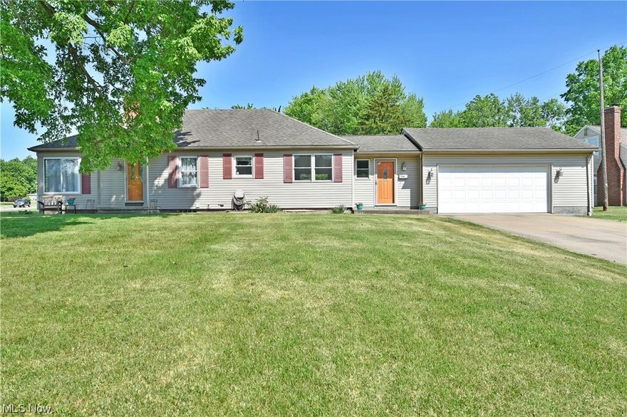 With two floors of exceptionally finished living space, this 2 possible 3 bedroon move-in-ready Warren ranch won’t be here for long! Prominently sat on a manicured corner lot, a tall tree casts afternoon shade across the handsome exterior, showcasing its natural color tones and bold accent doors. A fenced backyard includes both an additional storage shed and a relaxing raised rear deck. A glass lined formal entry door opens to a plush, carpeted living room. Sculpted plaster work creates unique rounded corners and stepped transitions on the inside walls. Opposite, an illustrious corner window ensures plenty of sunshine across the wood trimmed fireplace as it continues to fill the room. Tiled flooring separates the kitchen from a casual dining area with its glass tiled backsplash and bright white cabinetry. Around the corner, a remarkable great room makes for an excellent place to entertain with its stunning, raised tile work and plenty of natural light. Deck and attached garage access a