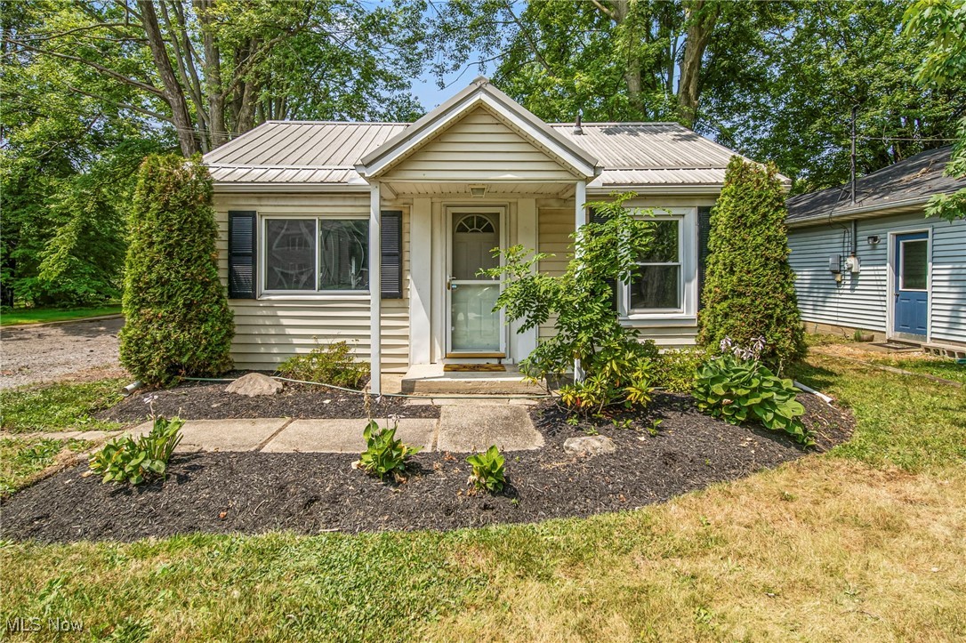 Adorable Beach Ranch with Lake Erie Views! Welcome to your beautifully updated 3 bedroom/2 bath ranch nestled in the desirable Lake Breeze Park community of Madison. This charming home has been thoughtfully rebuilt from the floor up with major improvements throughout. Enjoy peace of mind with a durable metal roof less than 5 years old. Step inside to fresh paint and stylish LVT flooring in a modern color palette. The open-concept kitchen & living area provide a bright, welcoming space. A brand-new primary full bath w/barn door was just added and the shared full bath has been updated for your convenience. The spacious laundry room offers plenty of space to create a home office or functional mudroom---tailored to your needs. Kitchen has a refresh with painted cabinets, new hardware, new countertops, sink and range hood. Outside, the private backyard offers serene views of Lake Erie. Lake Breeze Park is just down the road with members ONLY access at a low cost of $50/year--- a perfect place to gather, picnic, enjoy the lake and watch the sunset. Don't miss your chance to own this move-in ready gem by the lake. Schedule your showing today.