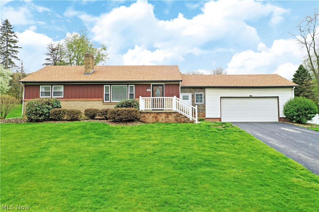 With two floors of perfectly showcased, move-in-ready living space, this lovely Brookfield ranch should be first on your list! Sat atop a grassy hill, the handsome residence beckons with its white picket entry and subdued natural colors with a two car attached garage. Inside, beautifully renovated rooms begin with a posh living room sat just past the formal entryway. A brick fireplace resides at the far wall as hardwood style flooring continues down the nearby hall. Opposite, formal dining sits before a masterfully updated kitchen with high gloss, granite countertops and accenting white tile work. The clean styling continues down into the fantastic bonus room where sliding glass doors illuminate the room with natural light. An electric fireplace adds a touch of style, making a great place to entertain or for casual dining. At the other end of the home, three spacious bedrooms are joined by a lavish full bath with its expertly tiled shower and basin sink. The large master bedroom offers
